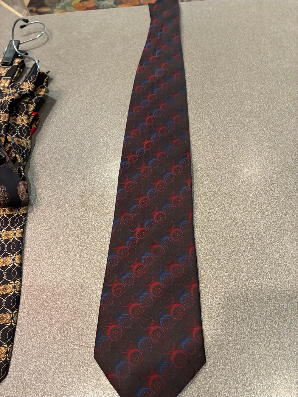 Hermes Maroon Tie with Red and Blue Circular Pattern